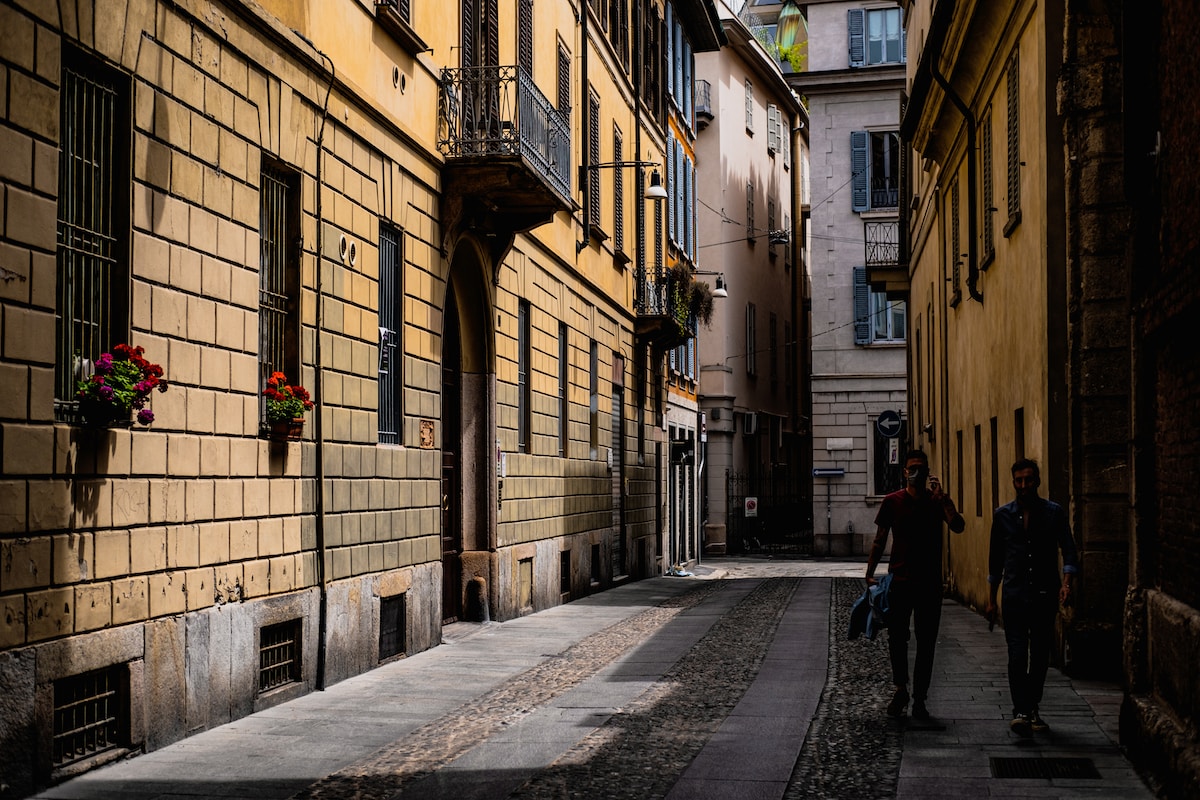people walking on sidewalk near building during daytime Brera District Milan