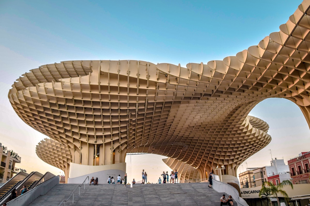 a group of people walking up and down a set of stairs - Metropol Parasol, Seville, Spain