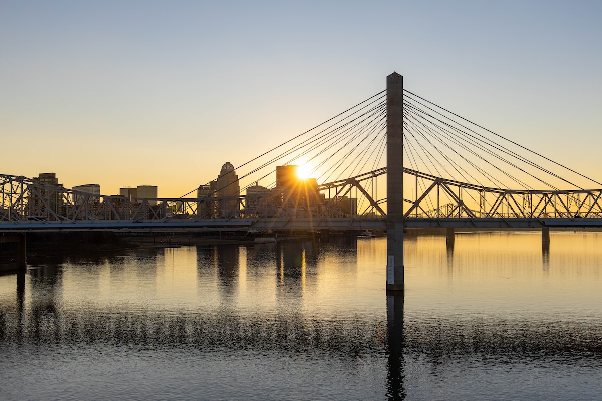 bridge over water during sunset - Louisville, KY, USA