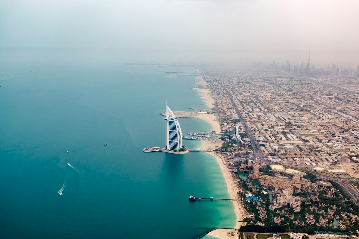 an aerial view of the burj al arab in the middle of the ocean - Dubai