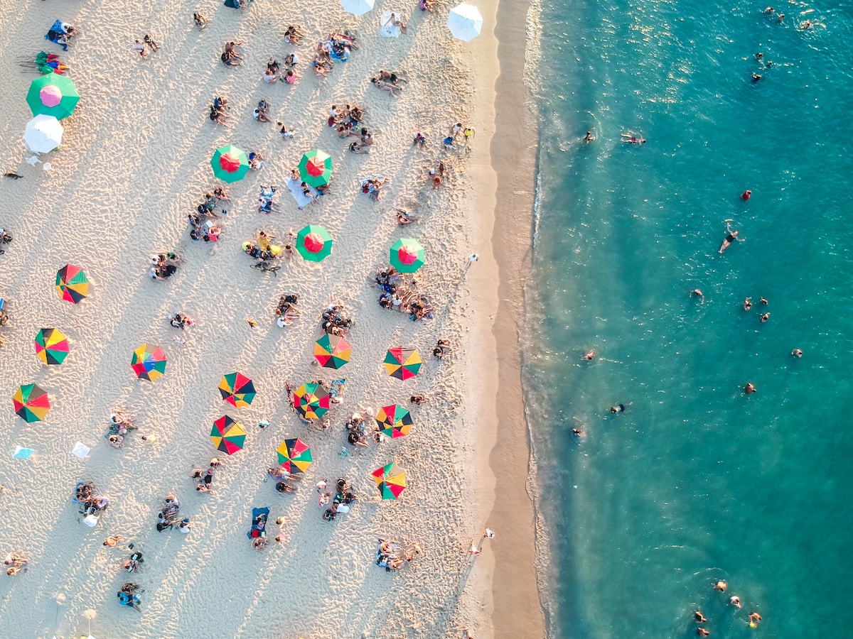 bird's eye view photo of people on beach - Lounge on the Miami Beach