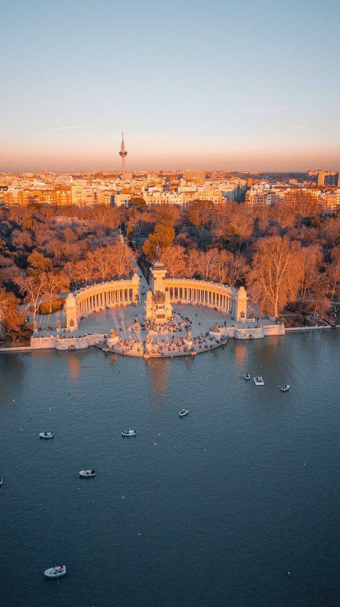 Madrid Spain - aerial view of white and brown building near body of water during daytime