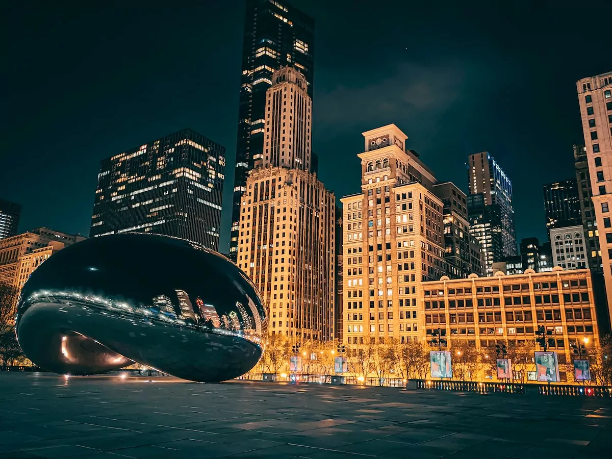 city skyline during night time - Chicago Bean