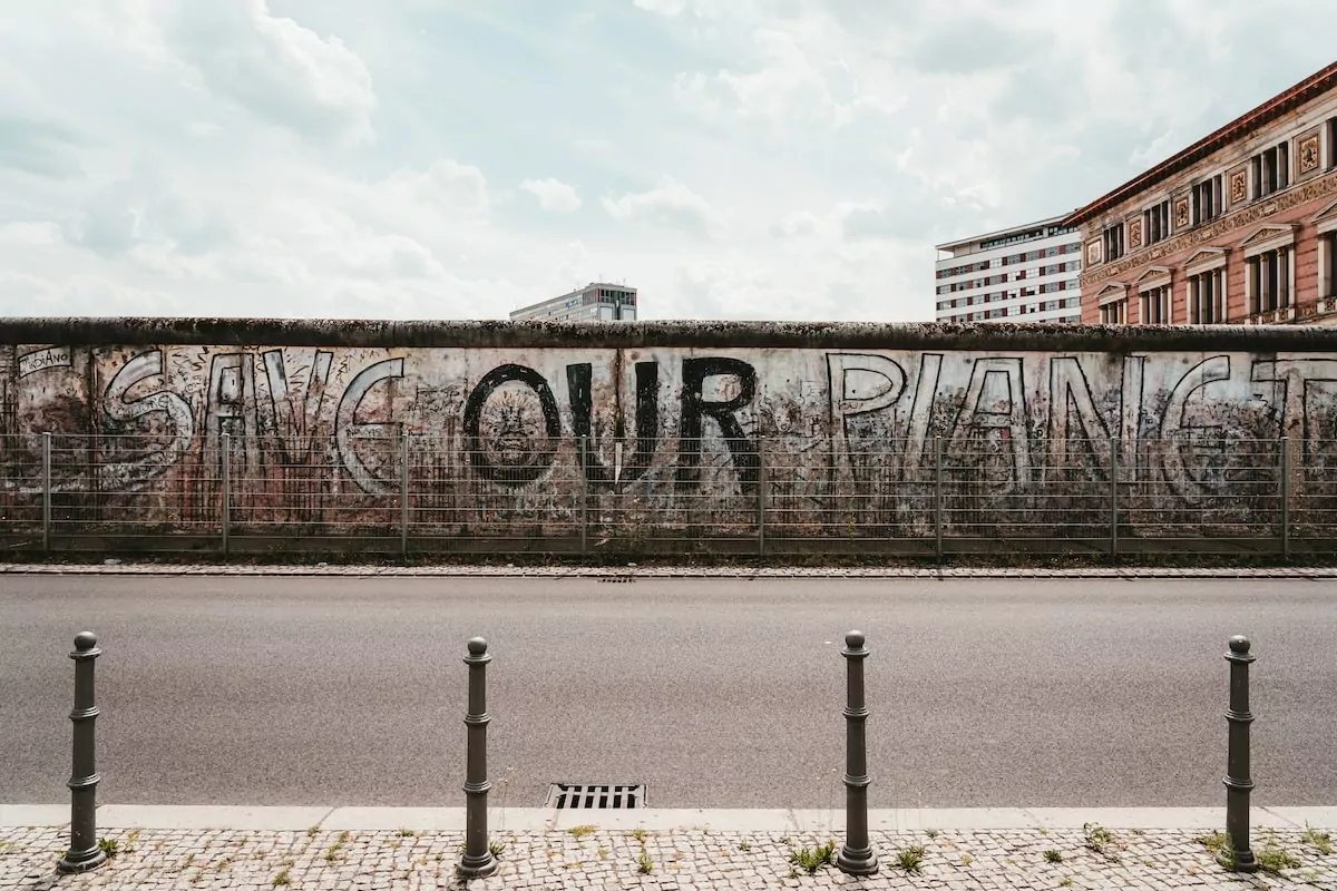assorted-color graffiti on wall - Berlin Wall Memorial