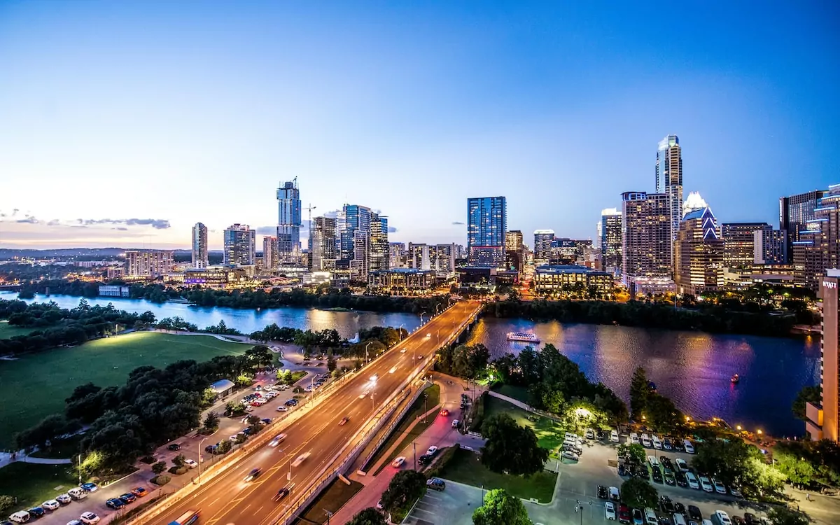 time-lapse photography car lights on bridge - Austin