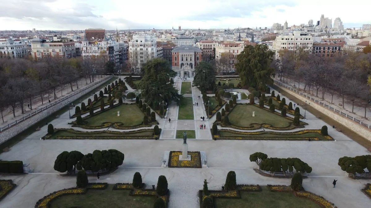an aerial view of a park with a lot of trees - El Retiro Park, Madrid, Spain