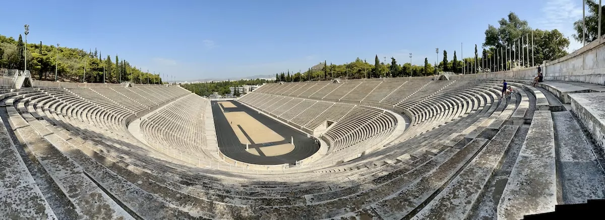 an empty stadium filled with lots of seats Panathenaic Stadium Athens Greece