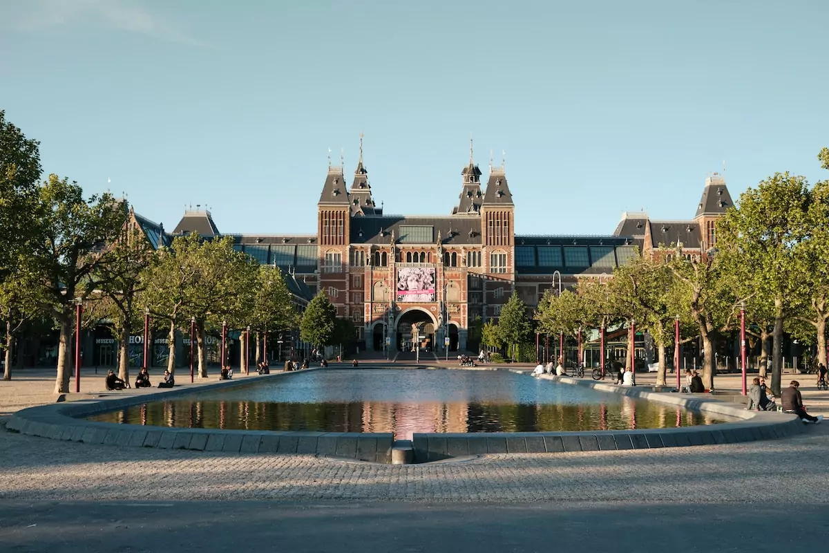 people walking on park near brown building during daytime - Rijksmuseum