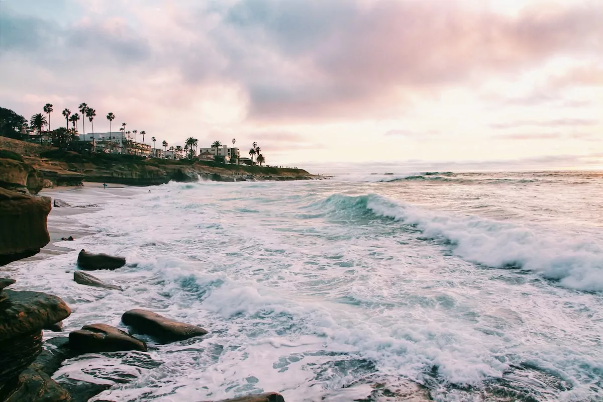 sea waves crashing on shore during golden hour - San Diego USA