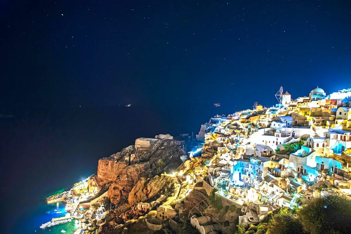 aerial view of city during night time - Santorini Greece