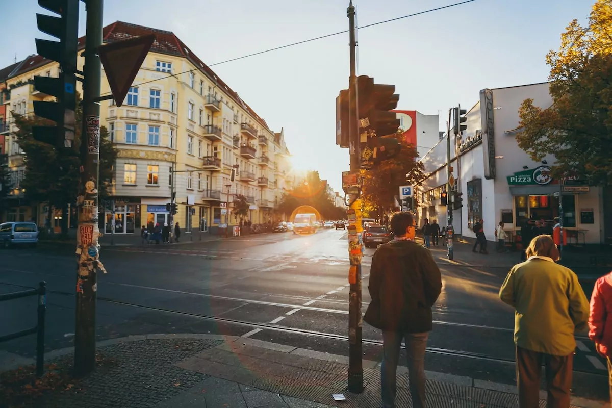 men walking near concrete buildings - Prenzlauer Berg Berlin