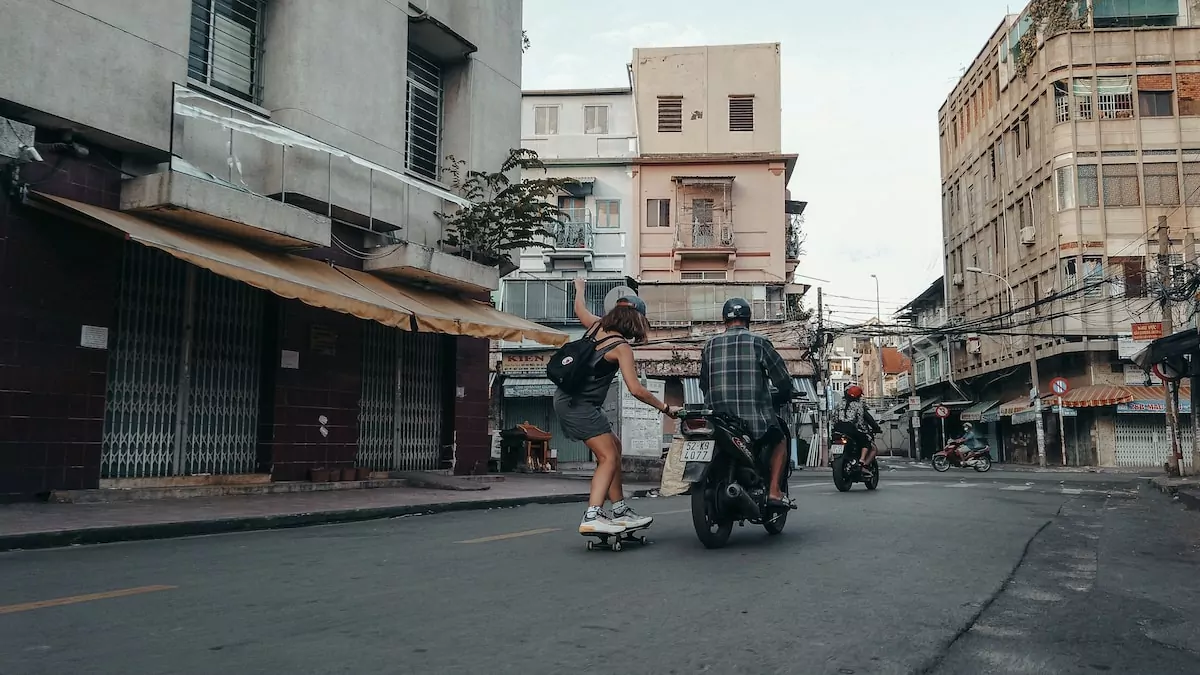 man in black t-shirt riding on black motorcycle during daytime - Chinatown Ho Chi Minh City