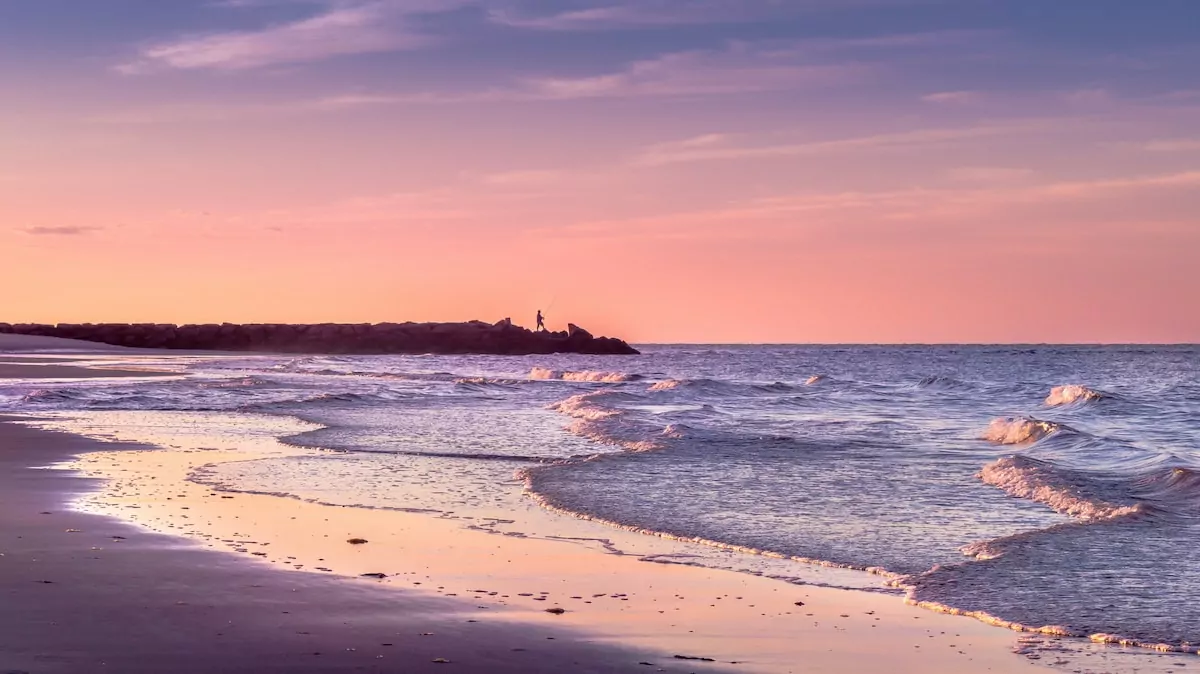 seashore viewing calm sea under orange skies - Cape Cod usa