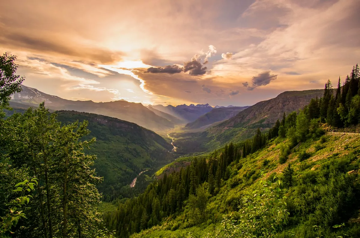 river and mountain ranges under white clouds - Montana USA