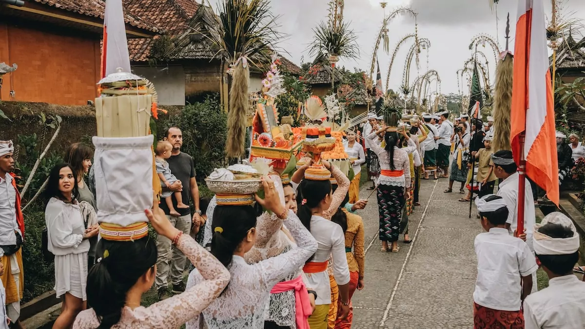 group of people parade on street - Budaya Bali